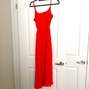 Floor length accordion style dress.